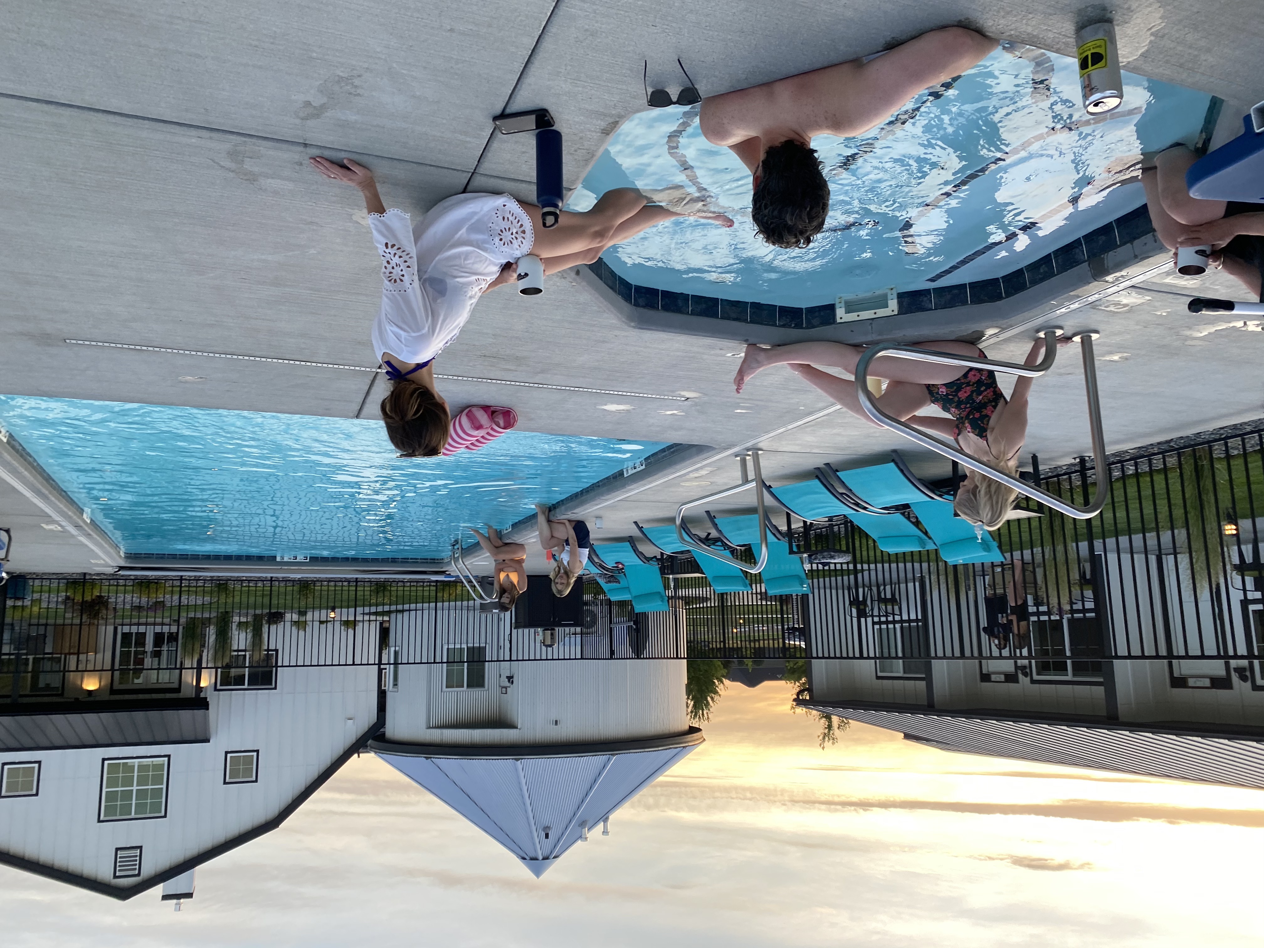 Guests enjoying the heated outdoor pool, hot tub. Also showing the silo suite and main barn building