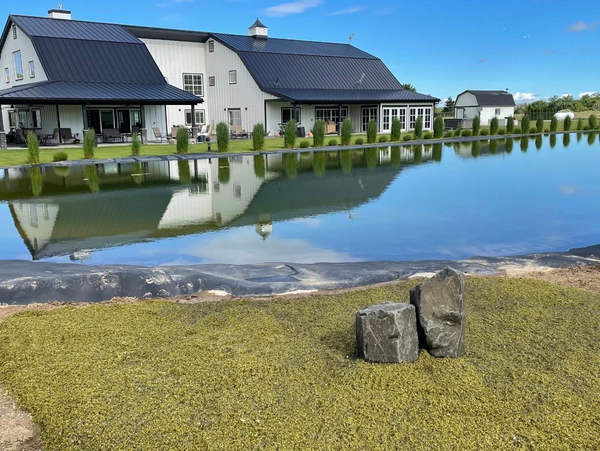 The barn reflected in the pond
