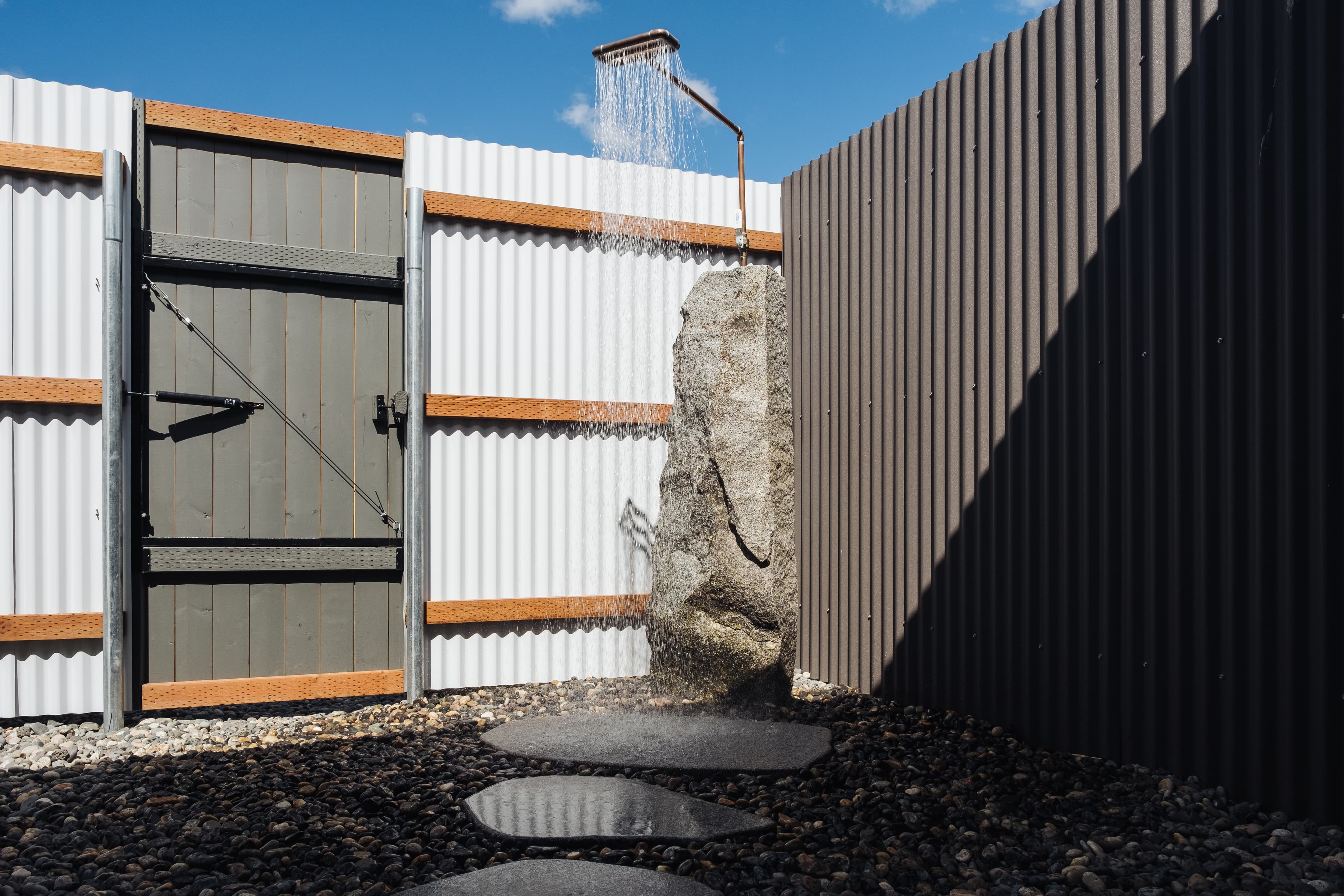 An outdoor hot water shower in the private Zen garden for each room