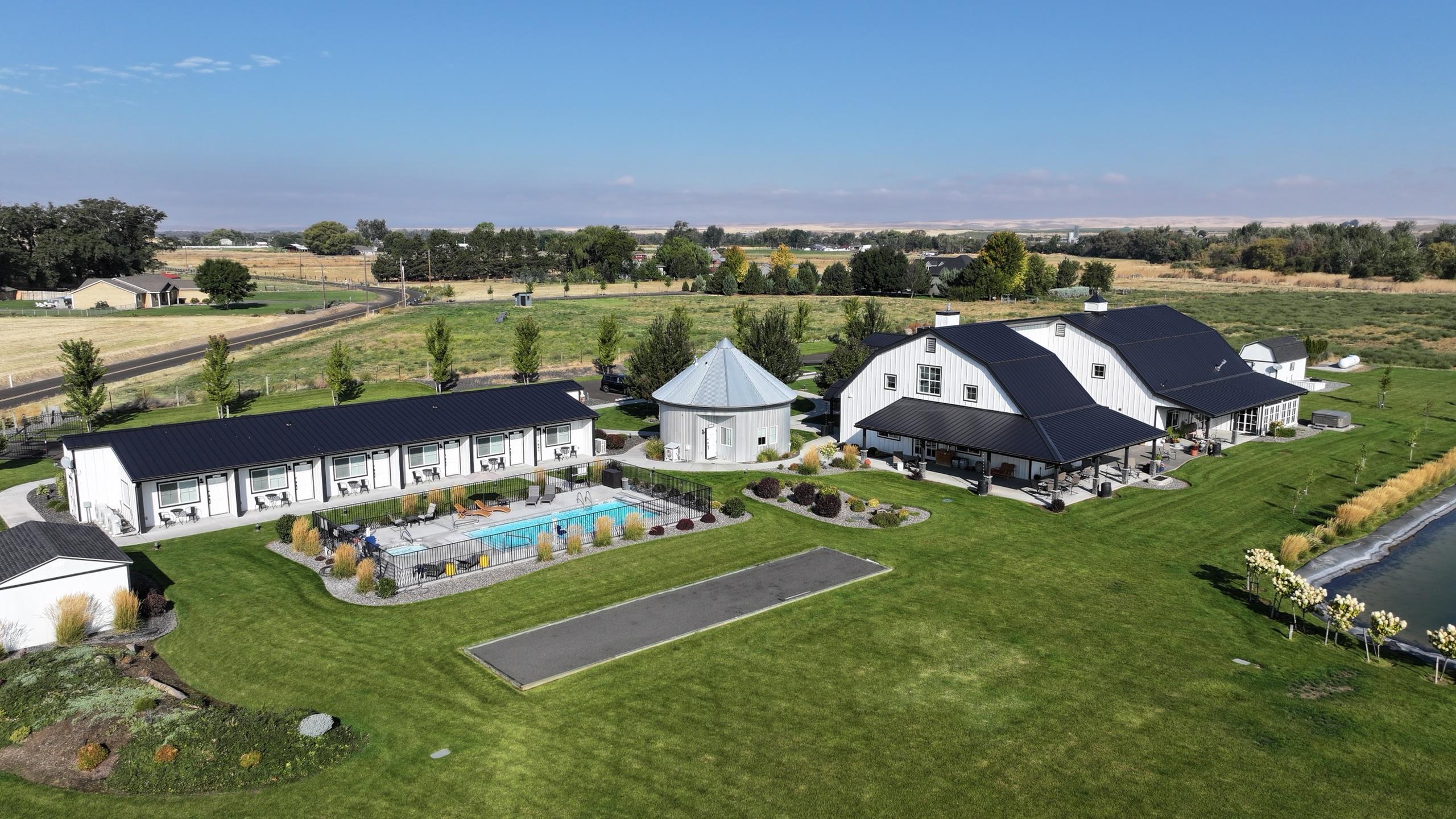 The Barn Walla Walla from above — the inn, bocce court and pool