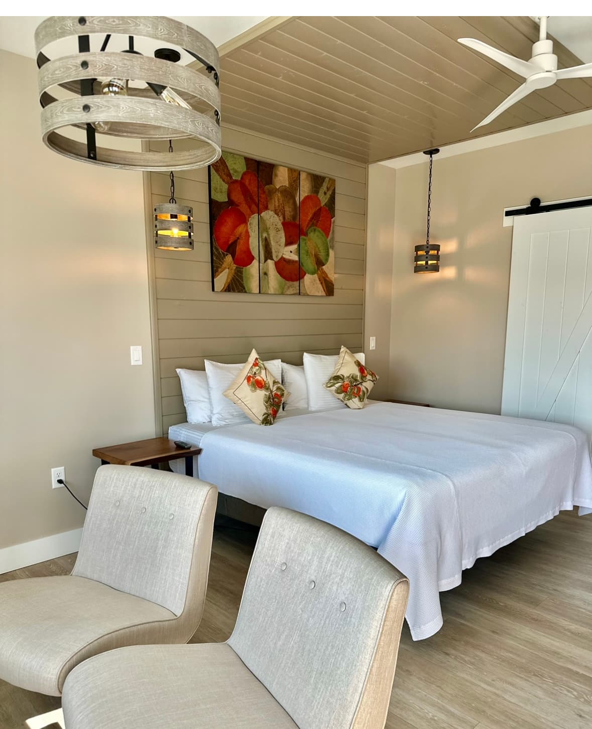 View looking into the suite showing King bed & custom artwork by owner Naina